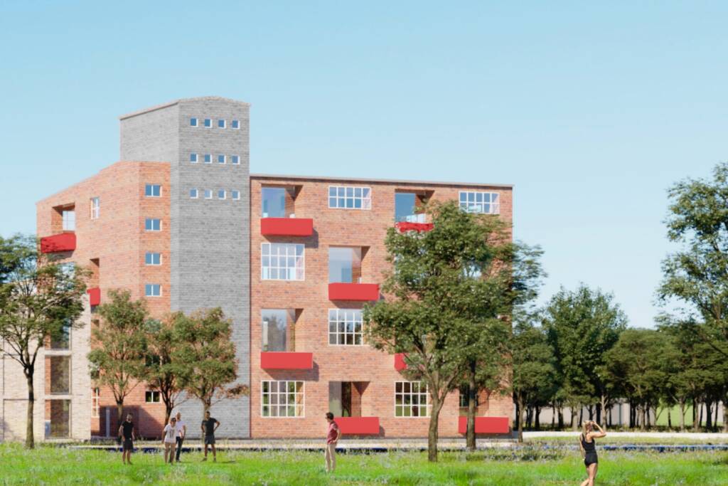 Ejerlejlighed i Odense med støbejernsvinduer og røde altaner